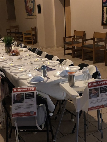 Empty chairs symbolizing the remaining 101 hostages, including two highchairs for abducted toddlers, at Pine Brook Jewish Center’s commemoration on October 6.