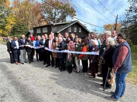 The 10/26/2024 ribbon cutting to mark the reopening of the Stickley Museum at Craftsman Farms. Former Parsippany Councilman Mike dePierro is standing center with the scissors