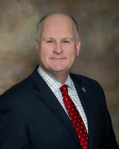 Sheriff Gannon posed for photo in a suit.