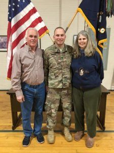 Morris County Sheriff's Officer Christopher Murarik in Army National Guard attire, with his parents
