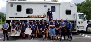 Participants of the Hanover Youth Public Safety Academy with Morris County Sheriff's Office Detective Bryan Bailey and Hanover Township police officers and firefighters on July 12.