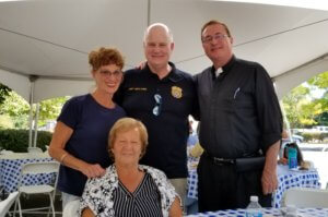 From left, Morris County Correctional Facility Volunteers Anna Marrano (seated), Linda Bartolotta, Morris County Sheriff James M. Gannon and Father Owen Moran at a volunteer appreciation barbecue Saturday, September 21, at the Morris County Correctional Facility. 