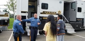 Morris County Sheriff's Office Detective Corporal Phil Mangiafridda explains his job in the Crime Scene Investigation Unit to youth members of a leadership group run by Team Eagle Foundation in partnership with the Boy Scouts of America Patriots' Path Council. 