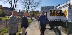 Morris County Sheriff's Office Detective Corporal Max Englert, of the Crime Scene Investigation unit, speaks with CALEA Assessors Thomas Clark and Charles Groover. 