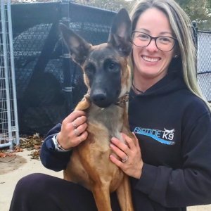Angela Riccio with a 5-month-old Belgian Malinois pup that she and her husband Jeff Riccio, founder and trainer of Riptide K9 in Plymouth, Massachusetts, are donating to the Morris County Sheriff's Office K9 Section. 