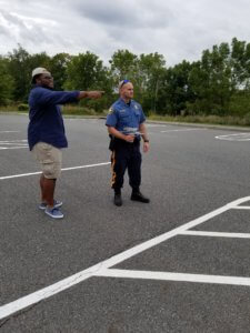 Morris County Sheriff's Officer Travis Somerville, right, practices with a hand-held receiver as part of his re-certification as an electronic search specialist with the Project Lifesaver Program. 