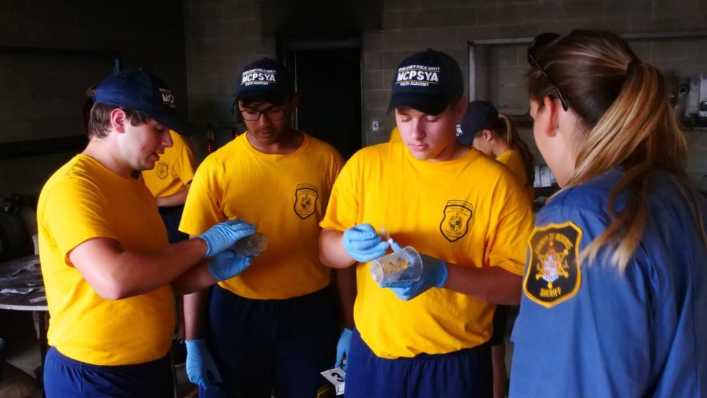 photo of students observing a police dog in action