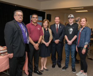 photos of (l-r) Joe Tamburelli, adjunct professor at CCM; Mihir Kansagra, a computer science student; Professor Patricia Tamburelli; Dr. Anthony J. Iacono, president of CCM; and computer science students Liam Shamhart and Andrea Doucette at the celebration recognizing CCM's designation as a National Center of Academic Excellence in Cyber Defense Education.