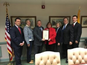 Photo of Freeholders holding proclamation for MS Awareness Week in Morris County