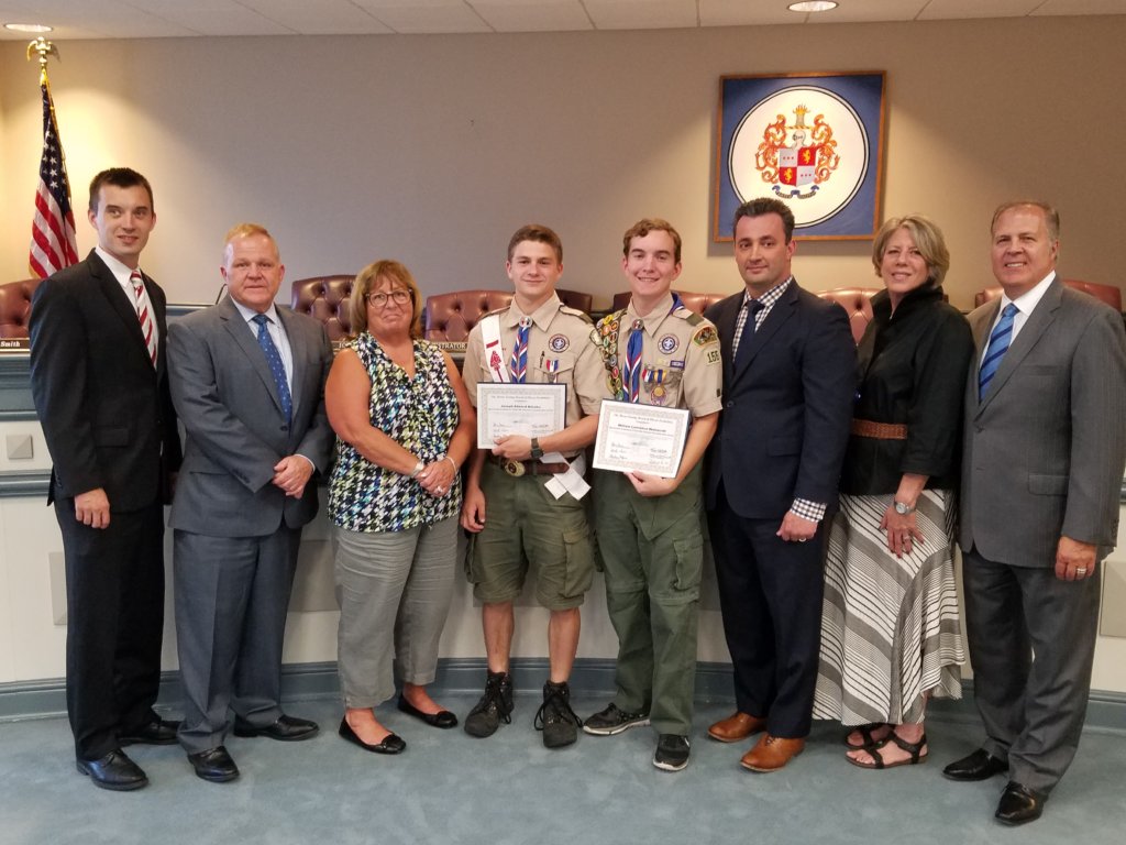 photo of (l/r) Freeholders Doug Cabana and Kathy DeFillippo, Scout Joey Mihalko, SCout Will Wainscott, and Freeholders John Cesaro, Deborah Smith and Tom Mastrangelo