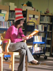 Heidi Peer wears Dr. Seuss hat as she reads to the kids