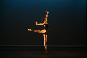 Serena Brown dancing against a dark background