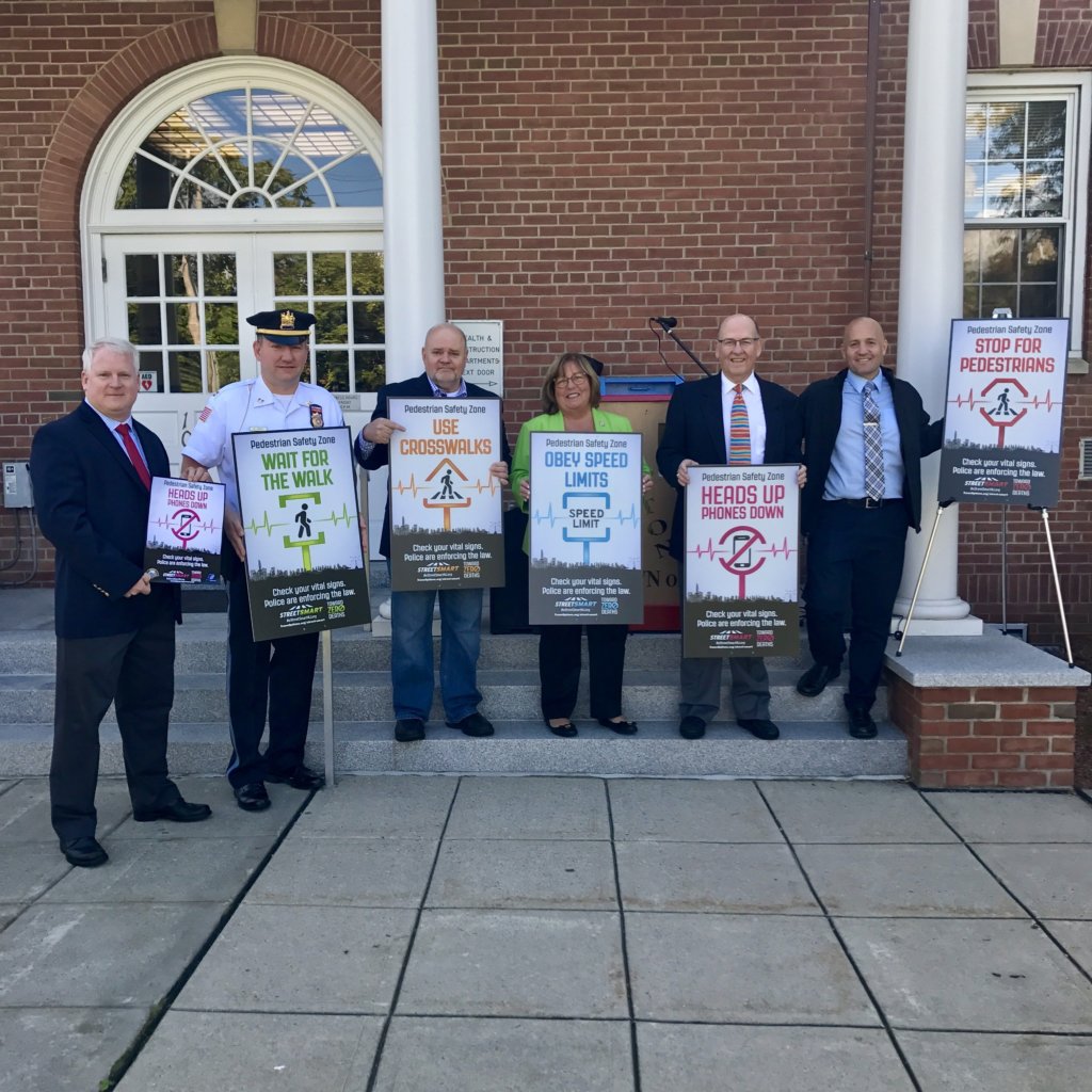 photo outside of Boonton Town Hall: (l/r) Will Yarzab, North Jersey Transportation Planning Authority; Boonton Police Capt. Stephen Jones; Boonton Alderman Bobby Tullock; Freeholder Kathy DeFillippo; TransOptions President John F. Ciaffone, and Boonton Mayor Matthew DiLauri