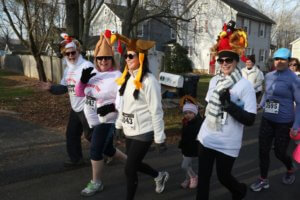 photo of runners wearing turkey hats