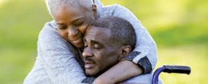 photo shows caregiver hugging loved one