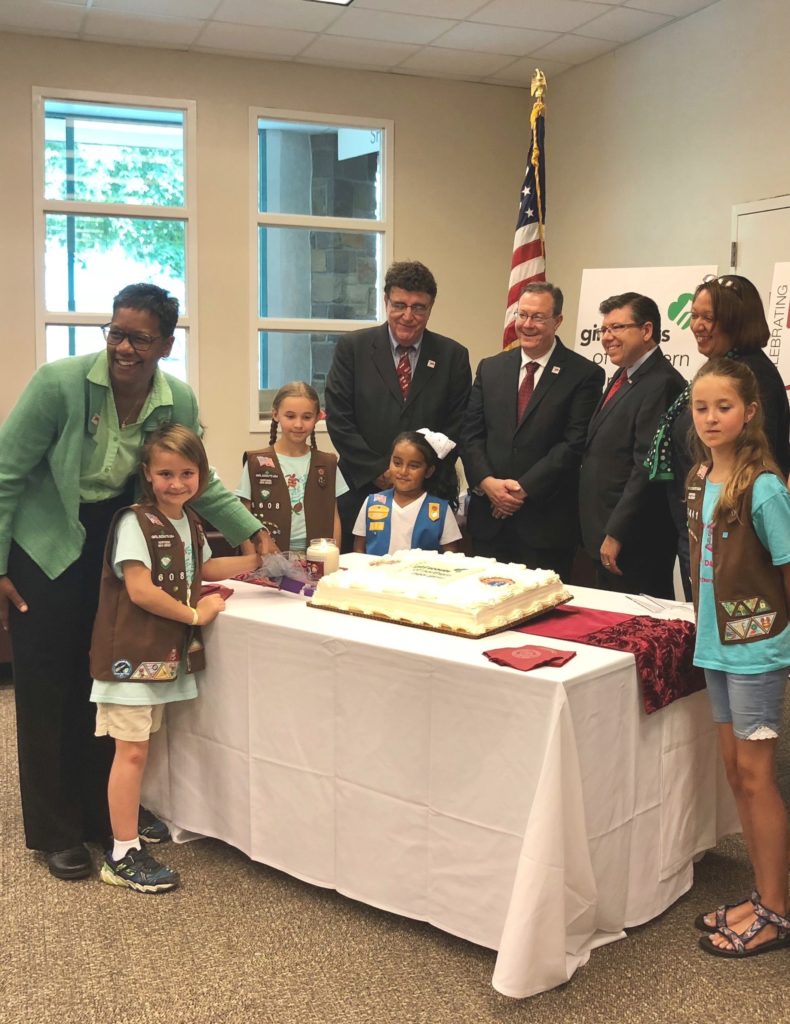 (l/r) Brownie Emilee Sajban of Vernon, Bette Simmons of CCM, Brownie Cecilia Sajban of Vernon, CCM Trustee Chair Paul Licitra, Daisy Zulmarie Briceno of Dover, CCM President Anthony J. Iacono, Assemblyman Anthony M. Bucco, Girl Scout of Northern New Jersey Chief Program Officer Charisse Taylor and Brownie Campbell Burns of Newton cut the cake at the reception announcing the launch of new national badges by the Girl Scouts.