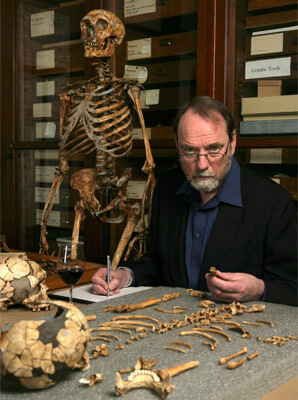 Ian Tattersall analyzing bones on a desk