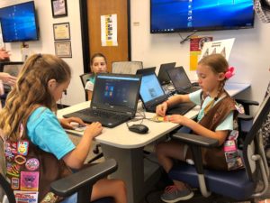 Girl Scouts from Northern New Jersey learn about cybersecurity in the Center for Cyber Security at County College of Morris during the launch of new national STEM badges.