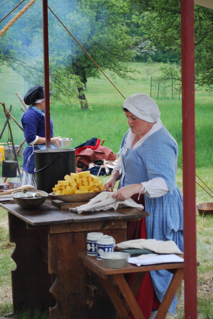 photo of Revolutionary era cooking demonstration by two female reenactors