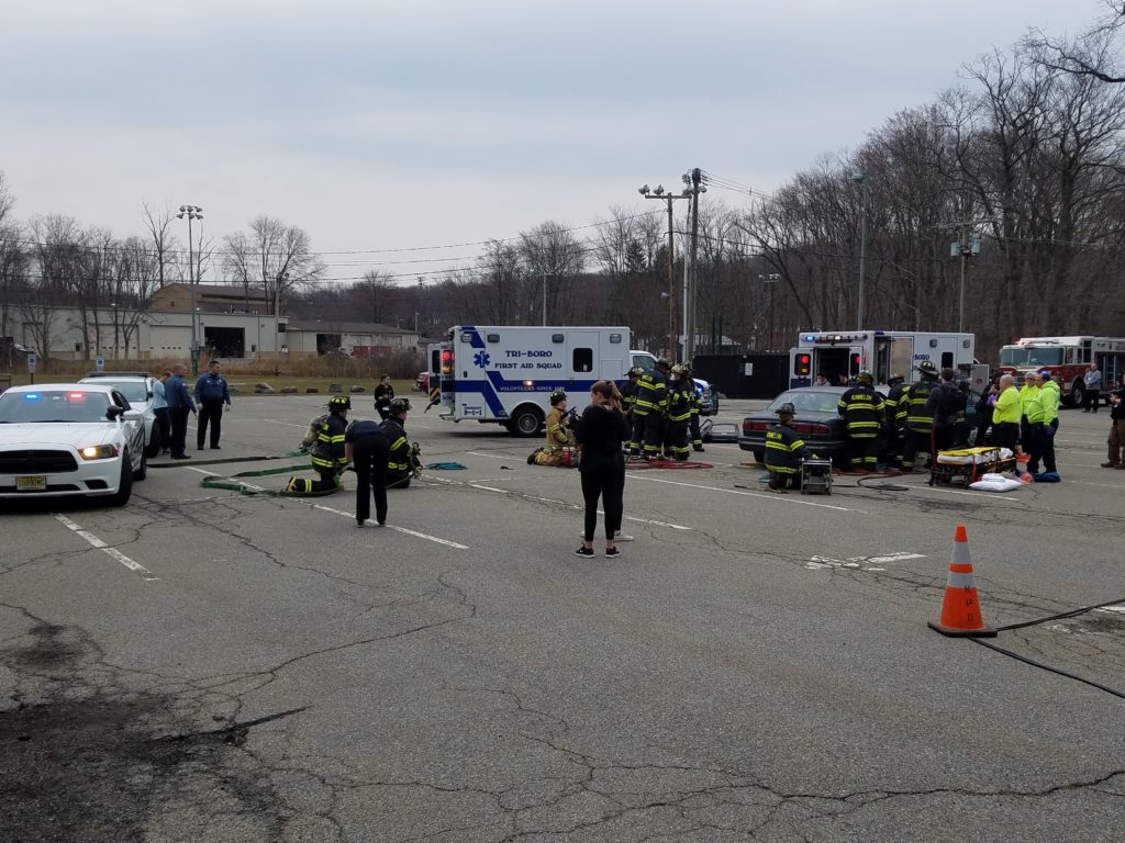 photo of mock accident scene in parking lot of Kinnelon High School
