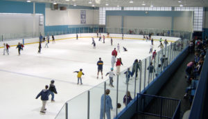 Ice skaters on the indoor rink at Mennen Arena.