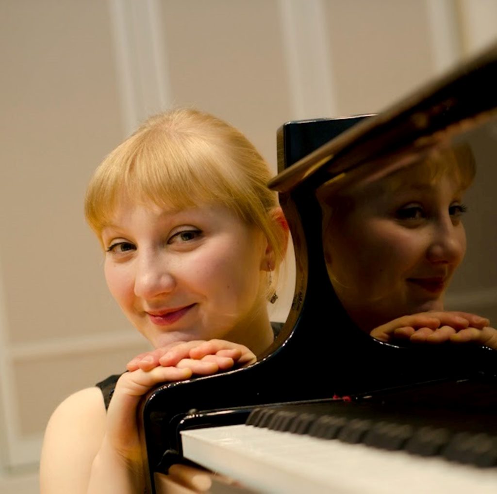 Pianist Maria Sumerva poses at the piano