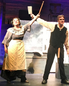 Mrs. Lovett holds a rolling pin and Sweeney Todd holds a cleaver in a scene from Sweeney Todd.