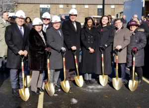 Officials pose with golden shovels.