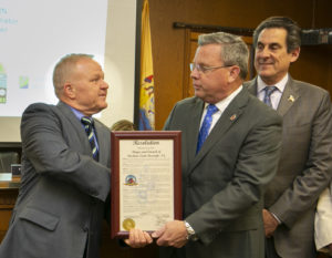 Freeholder Director Doug Cabana presents a resolution to Florham Park Mayor Mark Taylor during the Morris County Freeholders meeting held in the borough on Monday, May 6