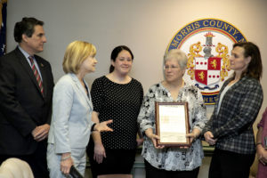 Laurie Becker offers words of praise to Susanne Graham at the Board of Freeholders event 