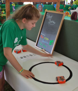 Girl checks out a robotics display