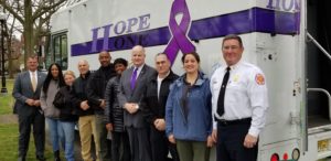 (l/r) Morris Undersheriff Mark Spitzer; MHA of Essex and Morris' Madine Despeine; Morris Sheriff's Cpl. Erica Valvano; Montclair Police Detective Sgt. Charles Cunningham; Montclair Deputy Chief Wilhelm Young; Family Promise of Morris County's Ashley Reed; Morris Sheriff James M. Gannon; Montclair Police Chief Todd Conforti; CARES Specialist Caroline Bailey; and Montclair Fire Department Chief John Herrmann