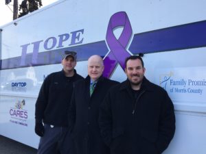 (l/r) Burlington County Sheriff's Office Chief Mike Ditzel, Morris County Sheriff James M. Gannon (center) and Burlington County Prosecutor's Office Chief of Investigations Darren Anderson, standing in front of the Hope One van in Netcong