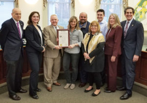 Morris County Freeholders and Chester Township Mayor and Council pose for photo holding county resolution in the council chambers