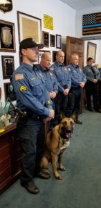 (l/r) Morris County Sheriff's Office Detective Corporal Michael McMahon, K-9 Kaiser, and fellow Sheriff's Officers, including members of the K-9 Section.