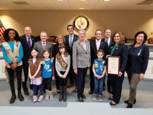 photo shows freeholders, five scouts, and two scout leaders holding Girl Scout Week proclamation