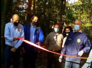 Freeholders John Krickus and Stephen H. Shaw cutting a ribbon with Mt. Arlington Mayor Michael Stanzilis